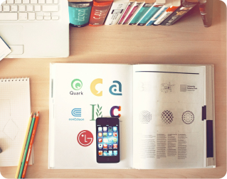Logo design examples on desk